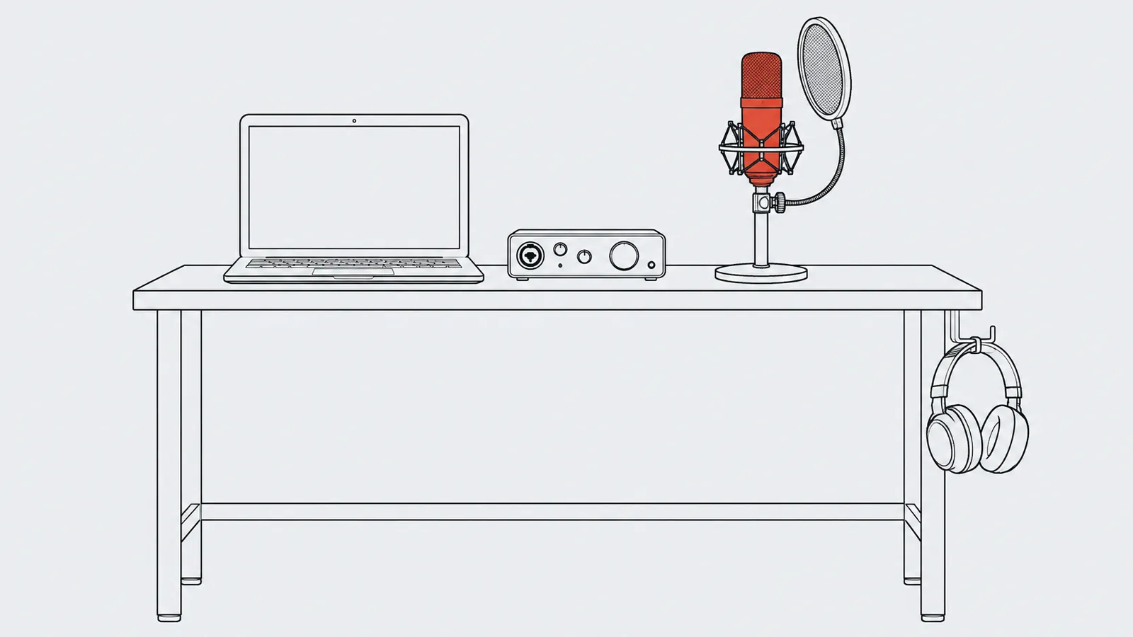 Een kleine bureauopstelling met laptop, interface, microfoon op een standaard en een hoofdtelefoon